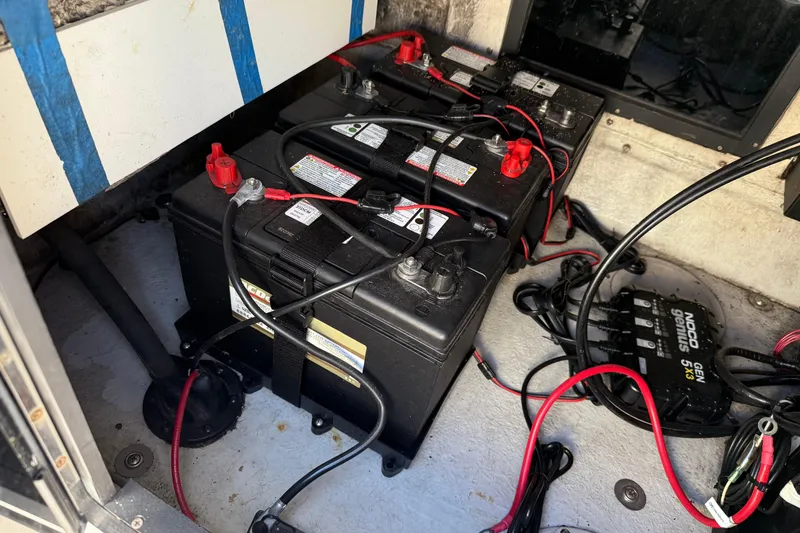 Slide: The Image of Battery compartment of a 1997 Hydra-Sports 2000 CC boat with wiring and charger. - 6