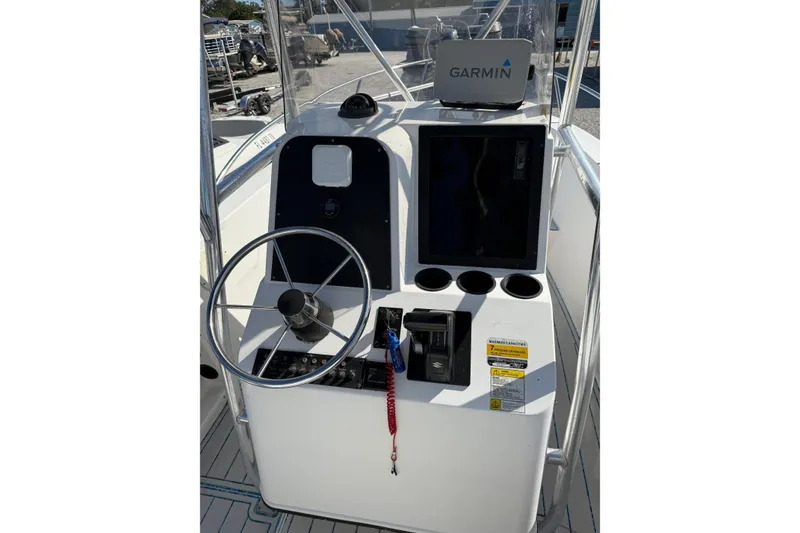 Slide: The Image of 1997 Hydra-Sports 2000 CC boat console with Garmin navigation system and steering wheel. - 8