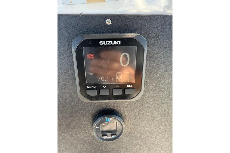 Slide: The Image of Suzuki digital display on 1997 Hydra-Sports 2000 CC boat dashboard. - 9