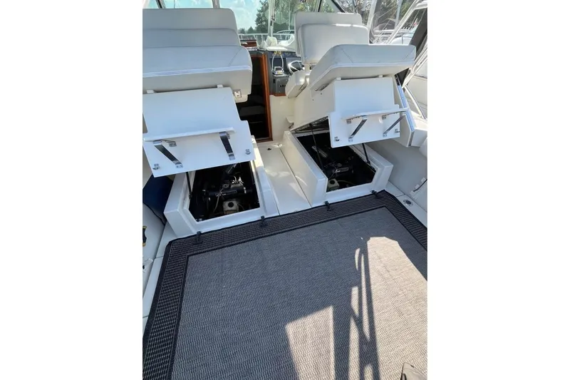 Slide: The Image of 1992 Tiara Yachts 2700 Open interior with open engine compartments and seating. - 17