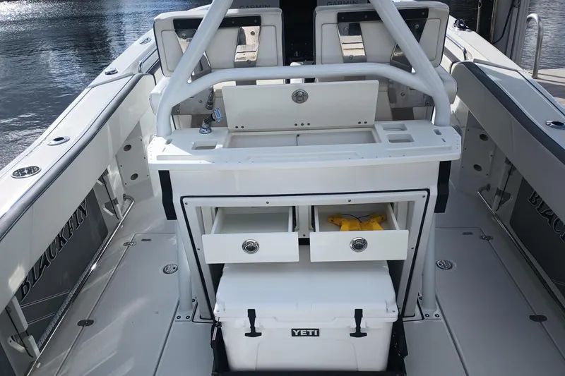 Slide: The Image of 2020 Blackfin 272 CC boat interior with storage drawers and Yeti cooler. - 18