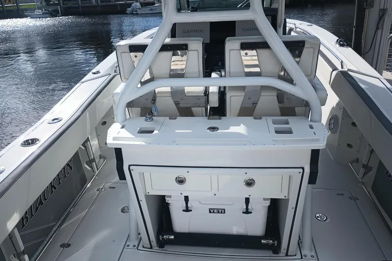 Slide: The Image of 2020 Blackfin 272 CC boat interior with seating and Yeti cooler. - 19