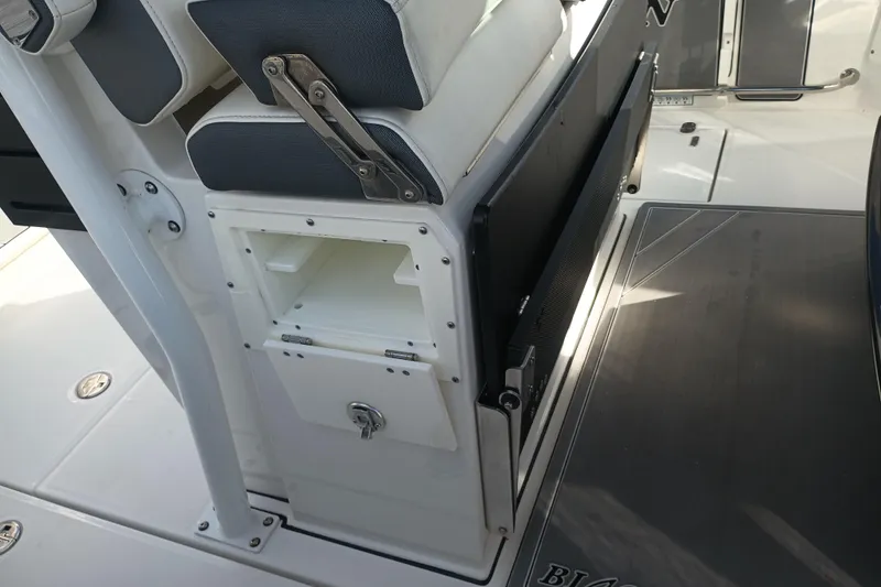 Slide: The Image of 2020 Blackfin 272 CC boat interior with storage compartment and seating. - 22
