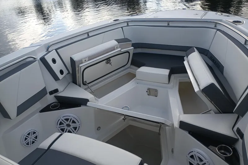 Slide: The Image of 2020 Blackfin 272 CC boat interior with cushioned seating and storage compartments. - 28