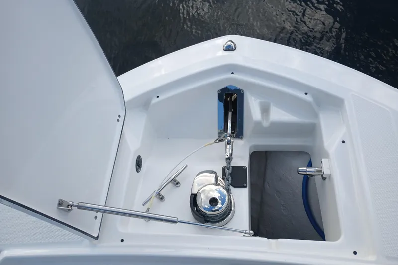Slide: The Image of 2020 Blackfin 272 CC boat anchor compartment with winch and chain. - 30