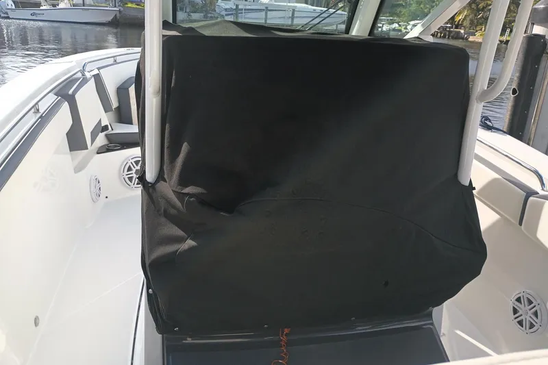 Slide: The Image of 2020 Blackfin 272 CC boat interior with covered console and seating area. - 33