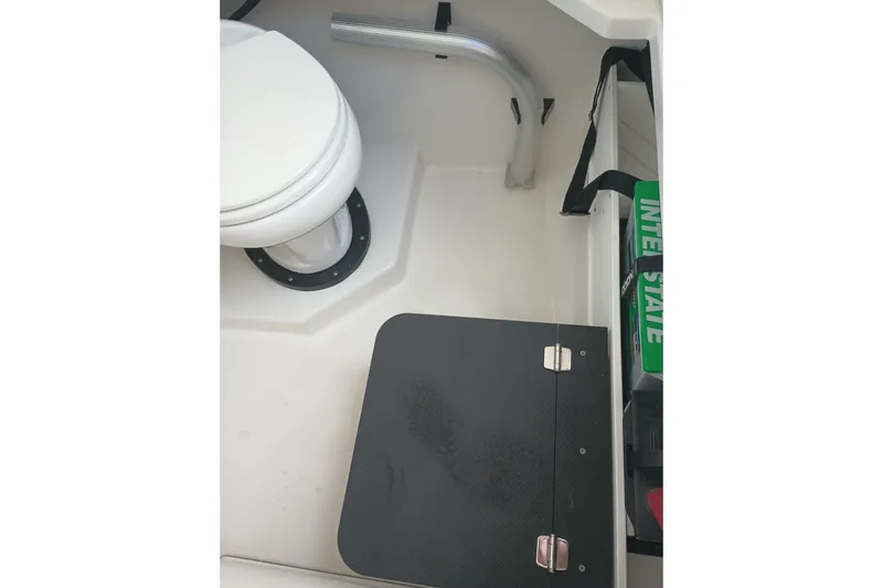 Slide: The Image of 2020 Blackfin 272 CC boat interior with toilet and storage compartment. - 37