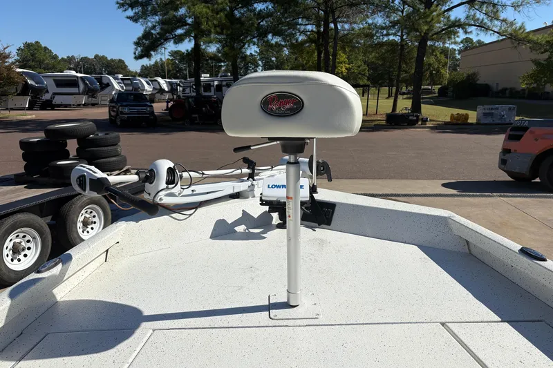 Slide: The Image of 2017 Ranger RB190 Bay boat with trolling motor and seat, parked outdoors. - 4