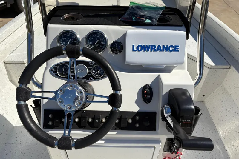 Slide: The Image of 2017 Ranger RB190 Bay boat dashboard with steering wheel, gauges, and Lowrance system. - 7