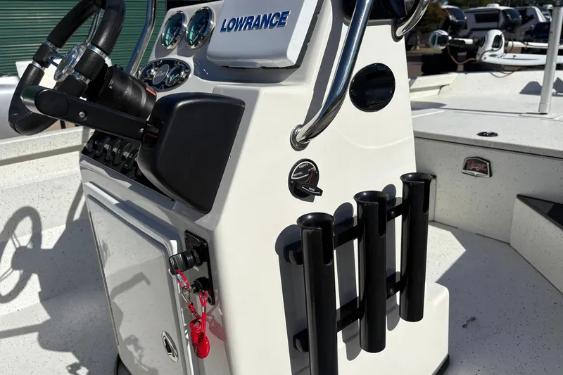 Slide: The Image of 2017 Ranger RB190 Bay boat console with steering wheel, gauges, and rod holders. - 8