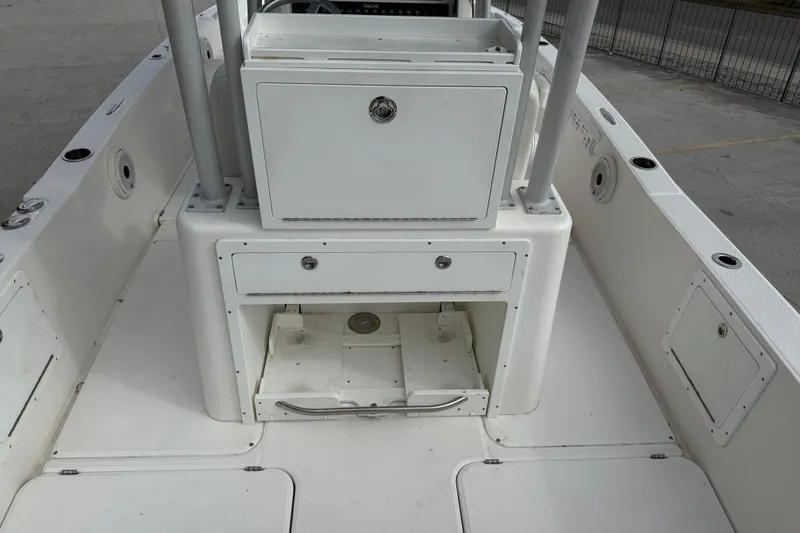 Slide: The Image of 2021 Sea Cat 260 boat interior with storage compartments and clean white deck. - 14