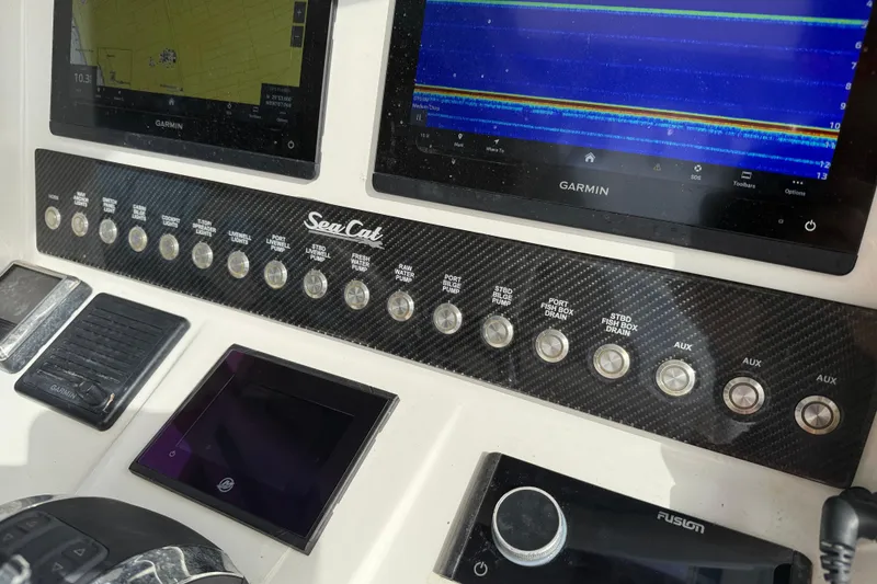 Slide: The Image of Control panel of a 2021 Sea Cat 260 boat with Garmin displays. - 16