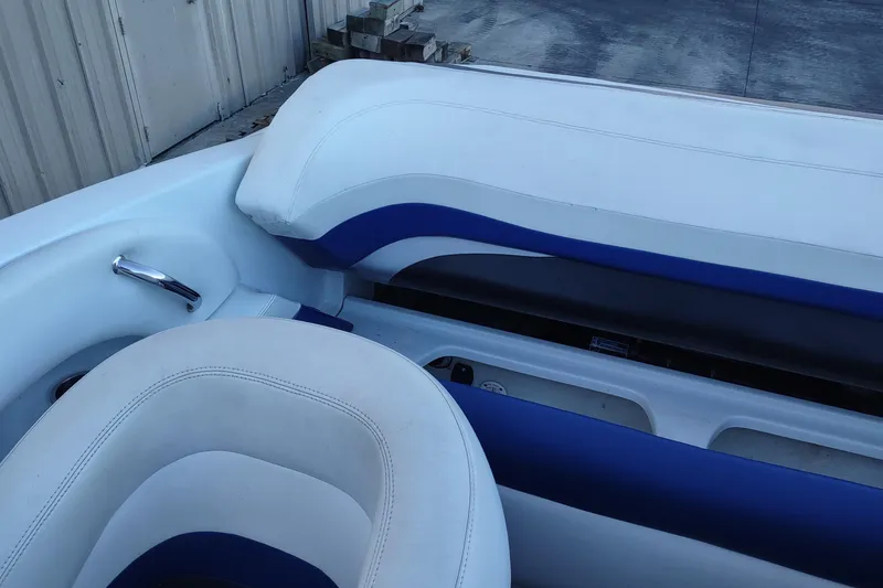 Slide: The Image of 2004 Baja H2X boat interior with white and blue seating. - 15