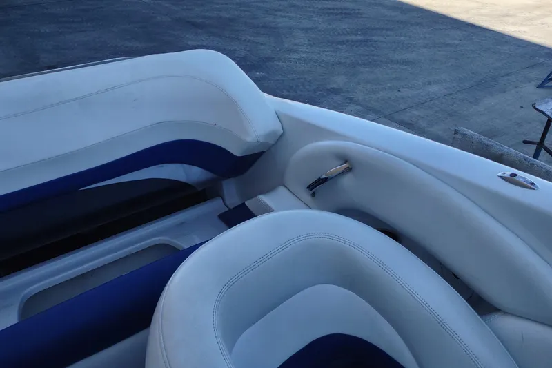 Slide: The Image of 2004 Baja H2X boat interior with white and blue seating. - 17