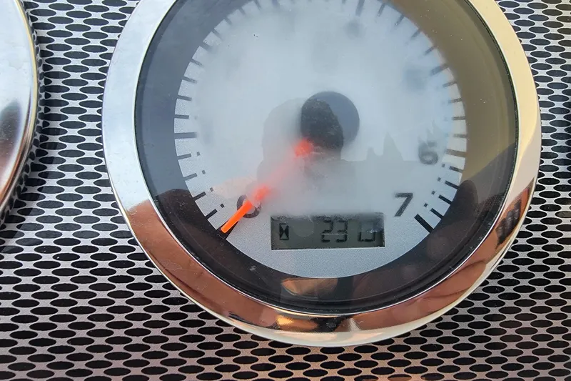 Slide: The Image of Close-up of a 2004 Baja H2X speedometer with digital display reading 230. - 22