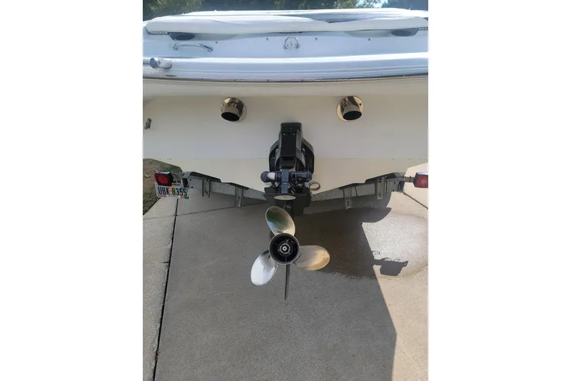 Slide: The Image of 2004 Baja H2X boat rear view with propeller and exhaust on trailer. - 25