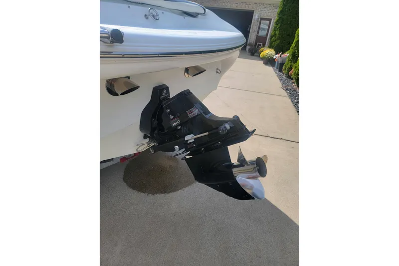 Slide: The Image of 2004 Baja H2X boat with a MerCruiser outdrive on a driveway. - 27