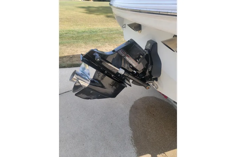 Slide: The Image of 2004 Baja H2X boat with MerCruiser outdrive on concrete surface. - 28