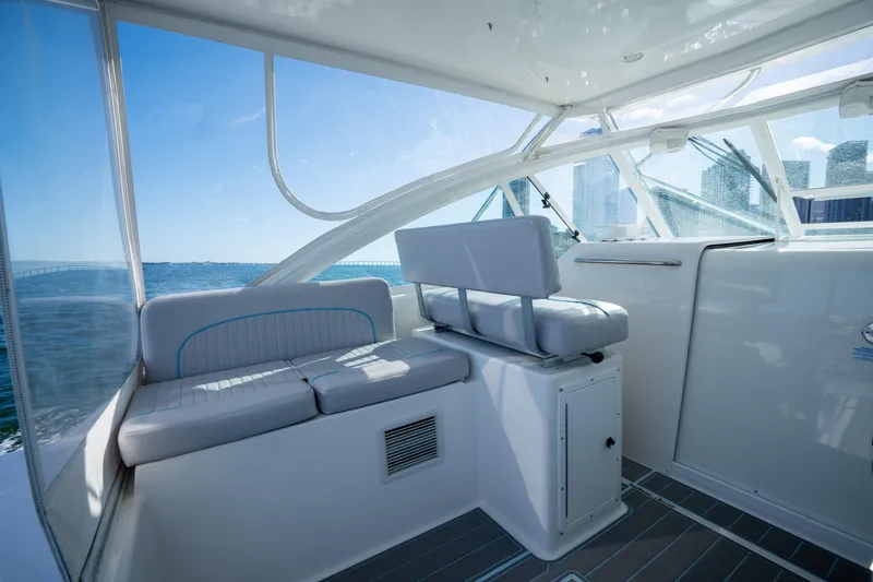 Slide: The Image of Interior of 2004 Cabo 35 Express boat with seating and ocean view. - 11