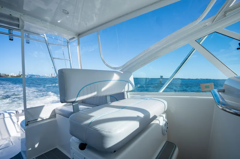 Slide: The Image of Interior view of 2004 Cabo 35 Express boat with ocean backdrop. - 13
