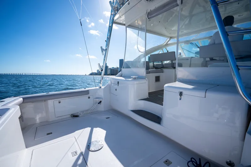 Slide: The Image of 2004 Cabo 35 Express boat interior with ocean view and clear blue sky. - 23