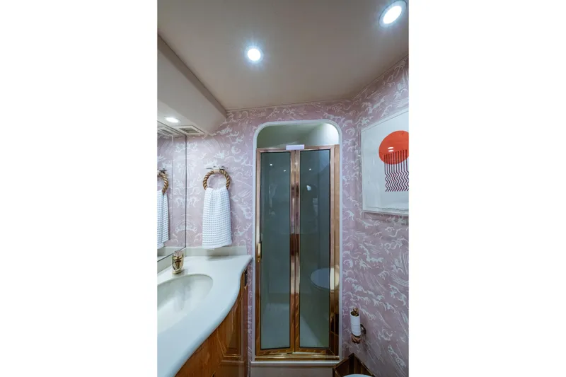 Slide: The Image of Luxurious bathroom in 2004 Viking 48 Convertible yacht with elegant shower and stylish decor. - 16