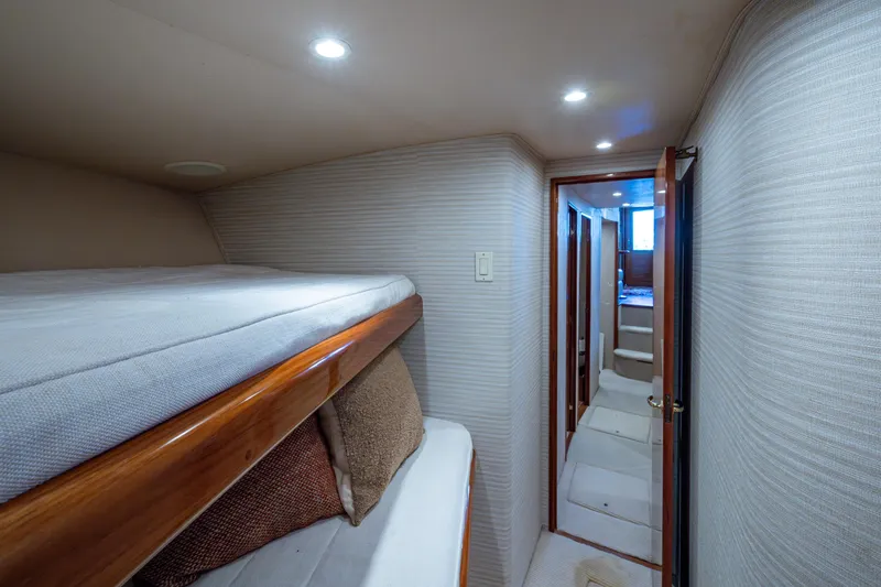 Slide: The Image of Interior of 2004 Viking 48 Convertible yacht with bunk beds and hallway view. - 19