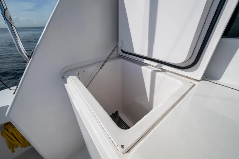 Slide: The Image of Open storage compartment on 2004 Viking 48 Convertible yacht deck. - 26