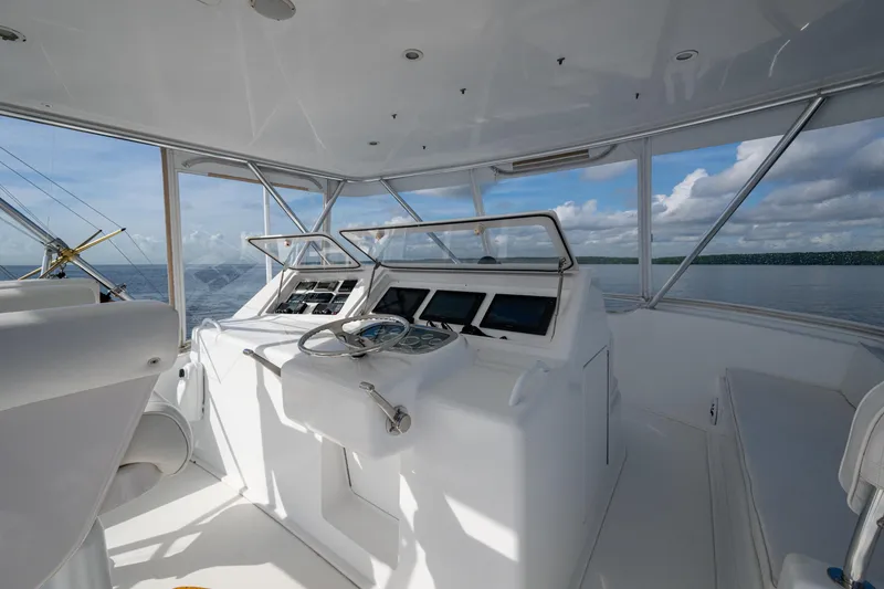 Slide: The Image of 2004 Viking 48 Convertible yacht helm with ocean view and modern navigation equipment. - 30