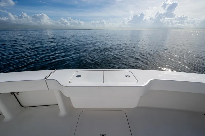 Slide: The Image of 2004 Viking 48 Convertible boat deck overlooking calm ocean waters. - 37