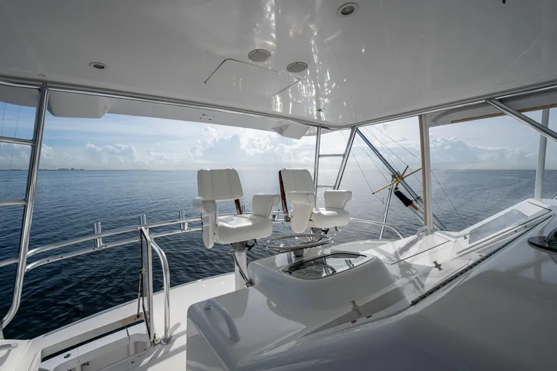 Slide: The Image of 2004 Viking 48 Convertible yacht interior with ocean view and captain's chairs. - 4
