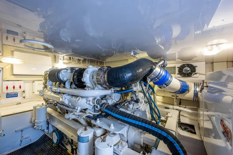 Slide: The Image of Engine room of 2004 Viking 48 Convertible yacht, showcasing detailed machinery and components. - 55
