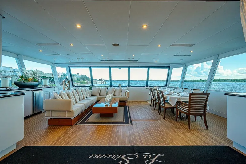 Slide: The Image of Luxurious interior of 2000 Christensen 141 Raised Pilothouse yacht with elegant seating and dining area. - 10