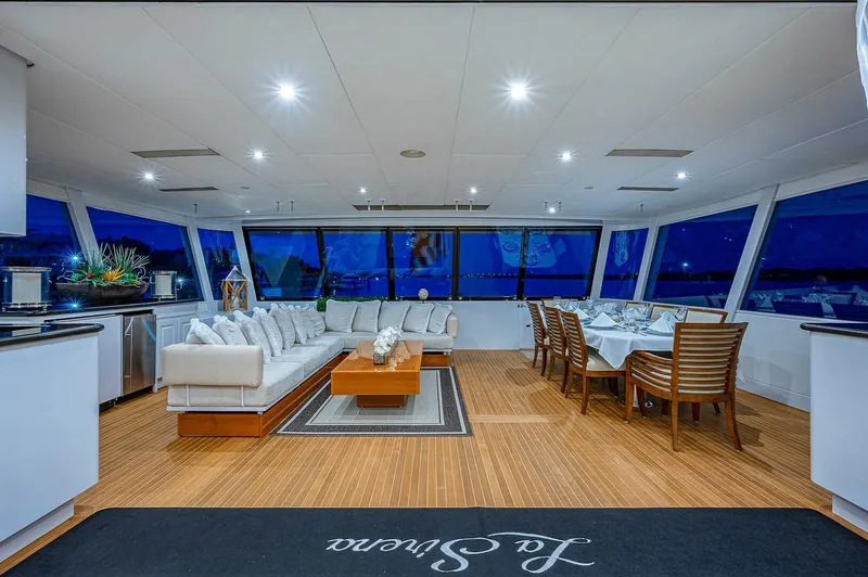 Slide: The Image of Luxurious interior of 2000 Christensen 141 Raised Pilothouse yacht with elegant seating and dining area. - 11