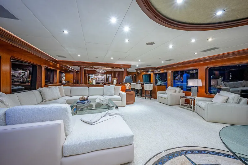 Slide: The Image of Luxurious interior of 2000 Christensen 141 Raised Pilothouse yacht with elegant seating and lighting. - 16