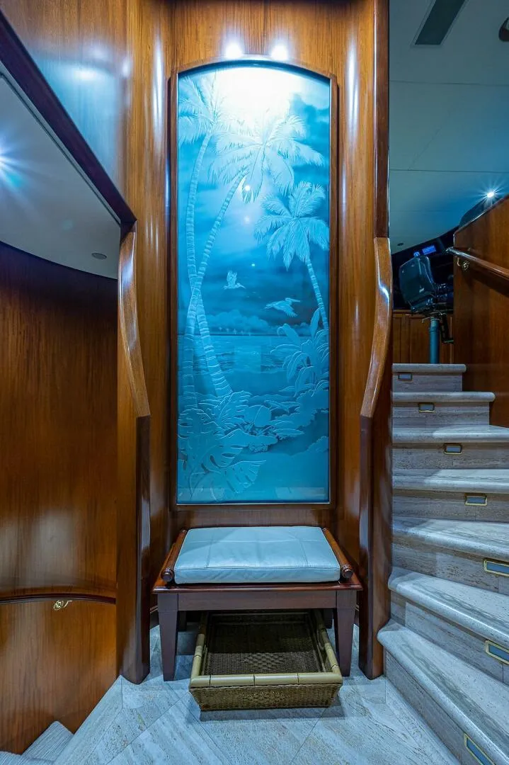 Slide: The Image of Luxurious yacht interior with etched glass panel, wooden accents, and staircase. Christensen 141 Raised Pilothouse, 2000. - 22