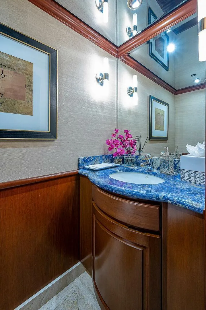 Slide: The Image of Luxurious bathroom in 2000 Christensen 141 Raised Pilothouse yacht with elegant decor and blue countertop. - 23