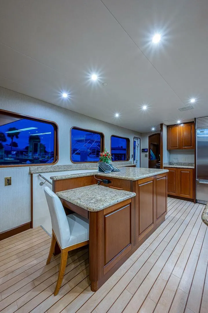 Slide: The Image of Luxurious interior of 2000 Christensen 141 Raised Pilothouse yacht with elegant wood and granite finishes. - 28