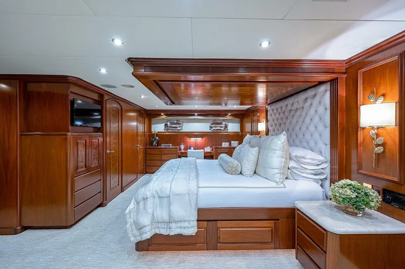 Slide: The Image of Luxurious bedroom in 2000 Christensen 141 Raised Pilothouse yacht with elegant wood paneling. - 34