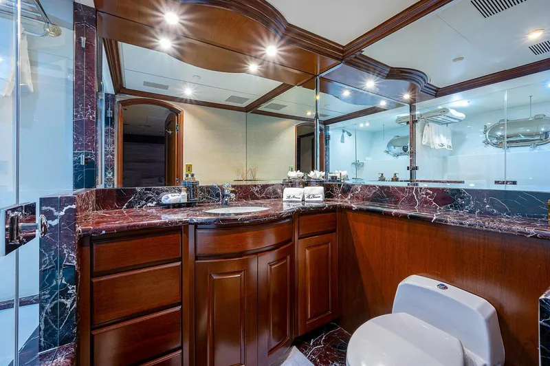 Slide: The Image of Luxurious yacht bathroom with marble countertops and wooden cabinetry, Christensen 141 Raised Pilothouse, 2000. - 43