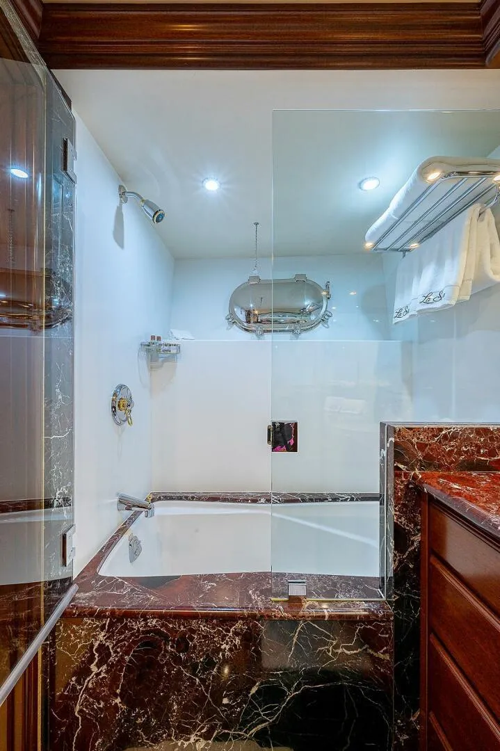 Slide: The Image of Luxurious bathroom with marble accents in a 2000 Christensen 141 Raised Pilothouse yacht. - 44