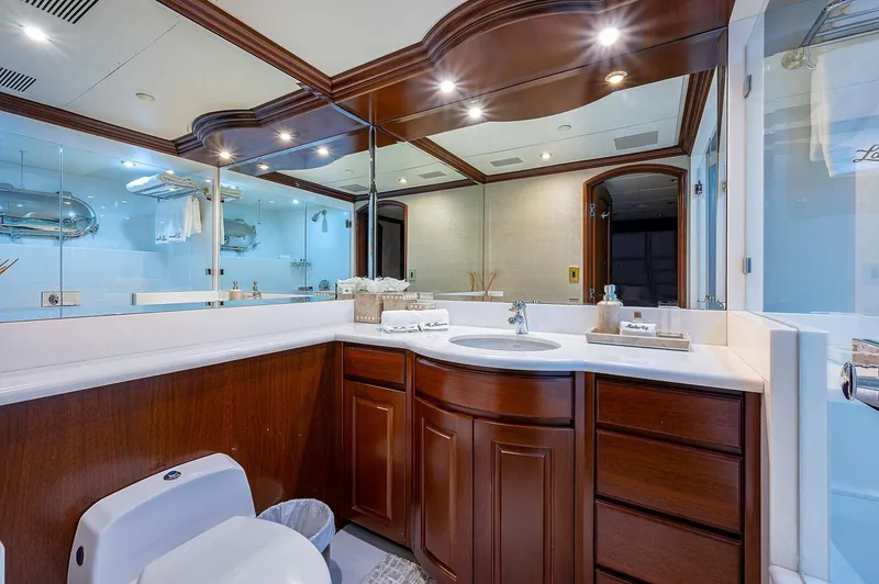 Slide: The Image of Luxurious bathroom on 2000 Christensen 141 Raised Pilothouse yacht with elegant wood cabinetry. - 47