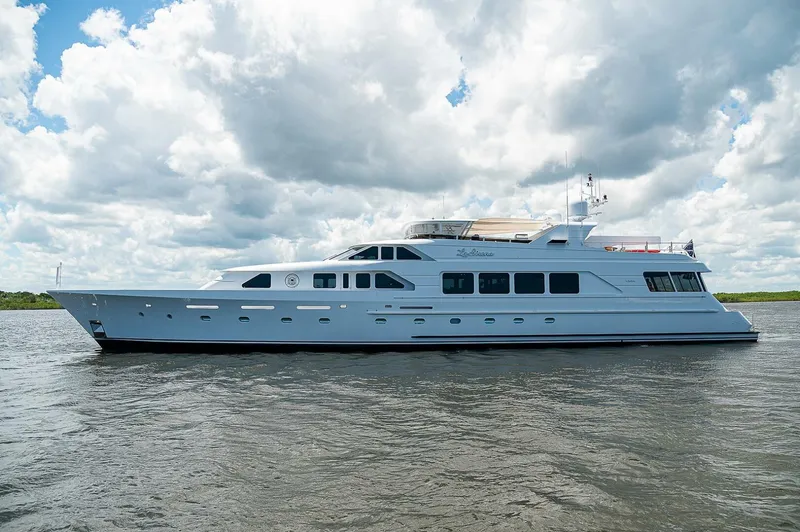Slide: The Image of Luxurious 2000 Christensen 141 Raised Pilothouse yacht cruising under cloudy skies. - 5