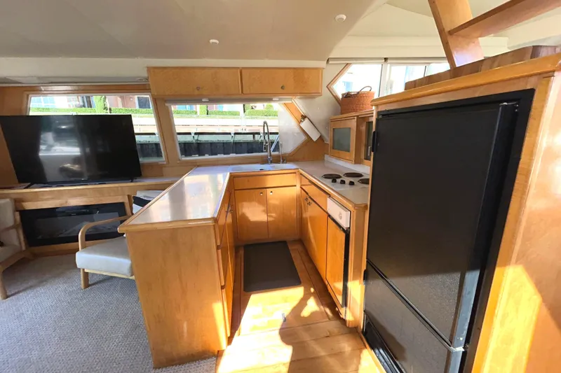 Slide: The Image of Interior of 1999 Navigator 53 Classic yacht with galley and salon, port side. - 15