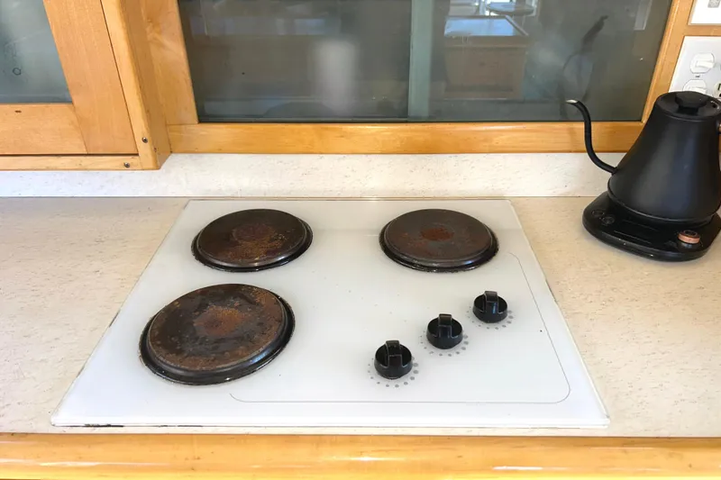 Slide: The Image of Electric stovetop with three burners - 21