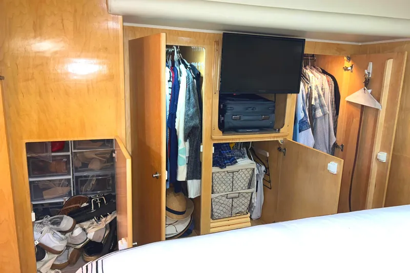 Slide: The Image of Spacious wooden closet in 1999 Navigator 53 Classic yacht Master Stateroom storage. - 34