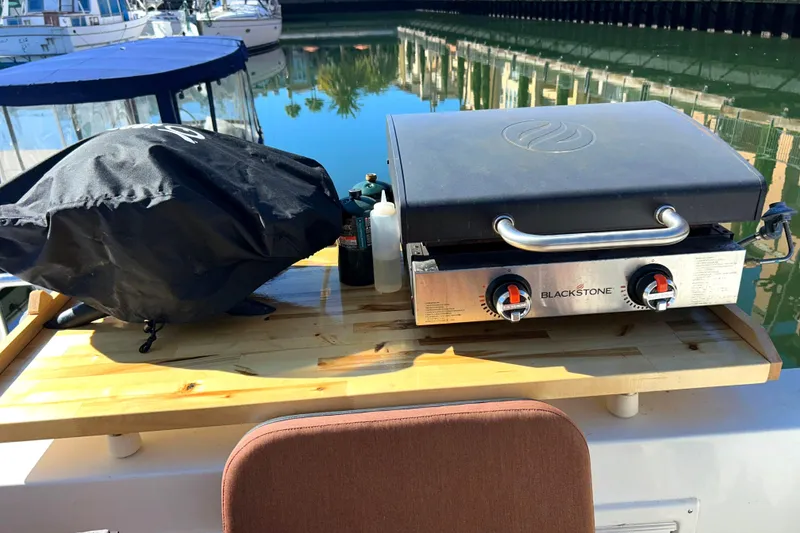 Slide: The Image of Transom BBQ grill, and Blacktone flat top grill - 51