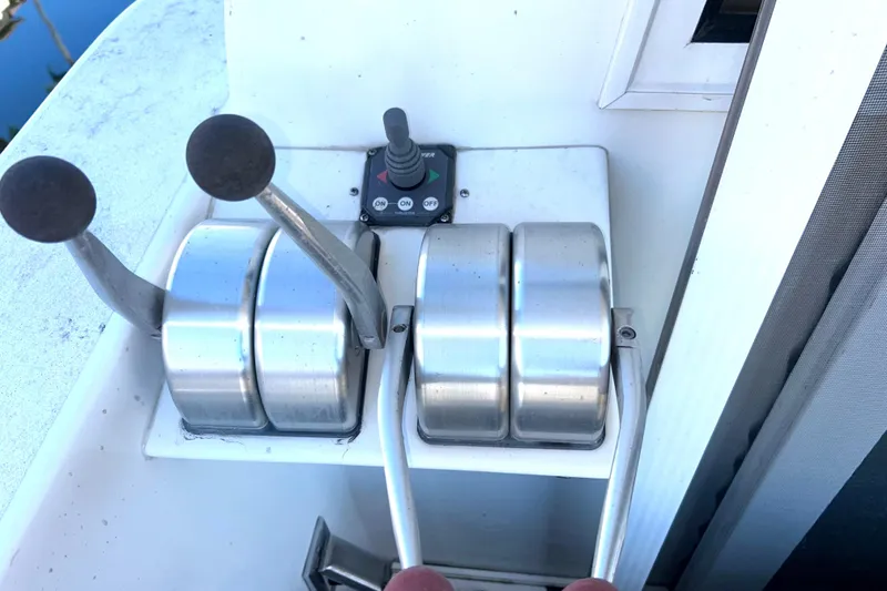 Slide: The Image of Cockpit engine controls with bow thruster. - 52