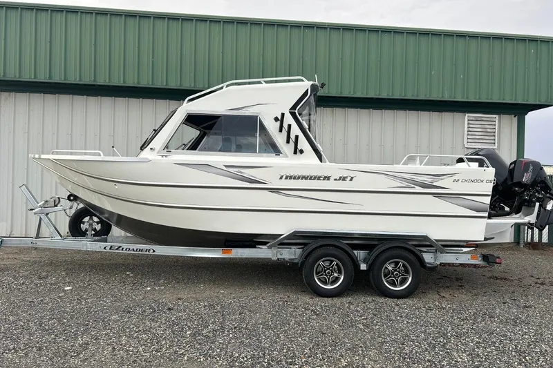 The Image of 2026 Thunder Jet 22 Chinook OS boat on trailer, parked outdoors. - 1