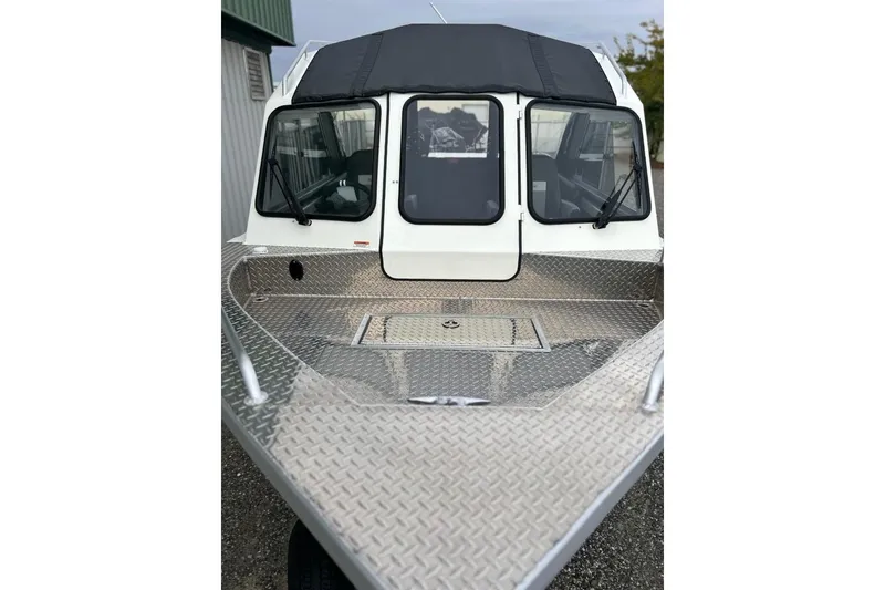 Slide: The Image of 2026 Thunder Jet 22 Chinook OS boat with aluminum deck and cabin windows. - 10